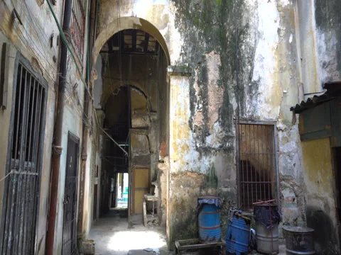 View inside a courtyard of old dilapidated poor houses in the slums at Ha Stock Footage 71038214