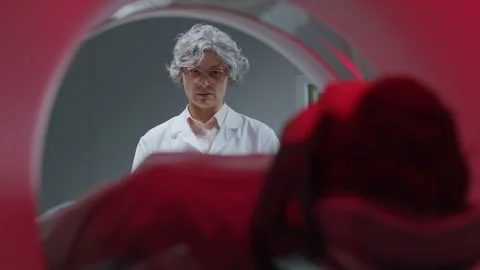 View from Inside of CT Scanner of Female Radiologist Monitoring Patient Vídeo Stock 335255669