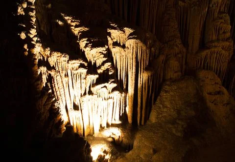 View inside of dark cave with stalactites Stock Photos