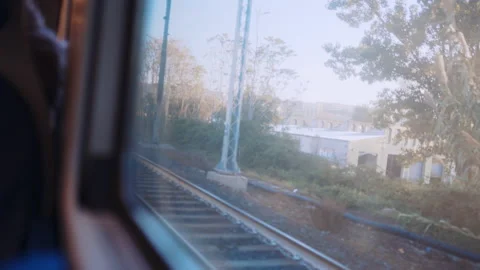 View from inside of driving train, local commute riding railways to approach Video stock 231599026