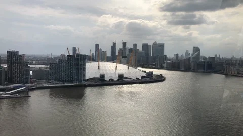 View from inside the Emirates Air Line looking towards the O2 Arena Stock Footage 113275413
