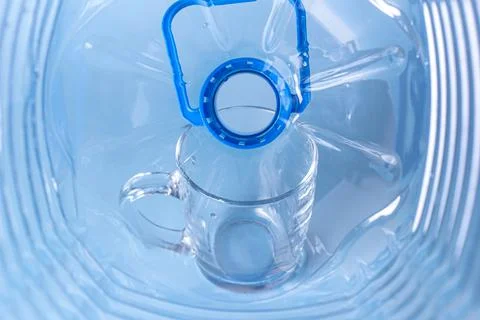 View from inside an empty plastic bottle against the background of an empty g Stock Photos