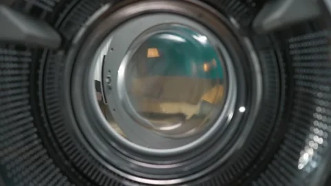 View from inside the empty washing machine young man walks into the room with Stock Footage 247465676