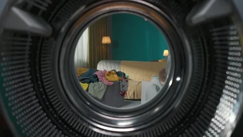 View from inside the empty washing machine with an opened door into the living Stock Footage 247470313