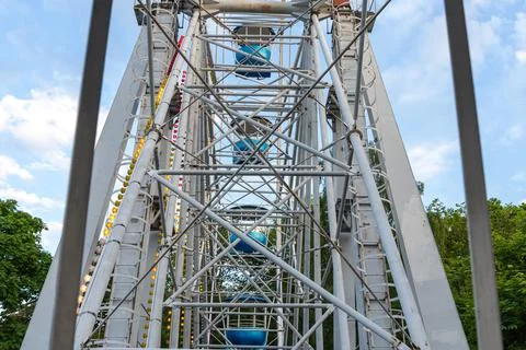View of Inside of Ferris Wheel view of the structure with cabins. Stock Photos