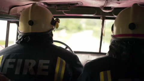 View Inside A Firetruck As A Fireman Drives To Respond To An Emergency Stock Footage 146144057
