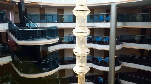View from inside the glass elevator of a multi-storey hotel. Video stock 77287153