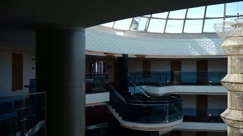 View from inside the glass elevator of a multi-storey hotel. The elevator mov Video stock 77294456