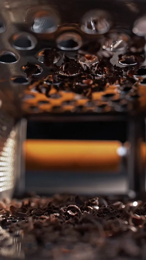View inside the grater while grating dark chocolate shavings. Stock Footage 281668699