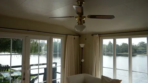 View from inside house boat with ceiling fan to national park "The Oude Venen" Video stock 147620680