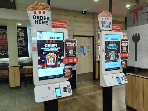 The view inside of KFC Restaurant serving halal fast food malaysian cuisine. Stock Photos