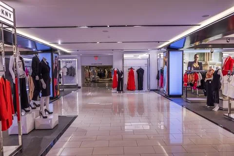 View inside Macy's store, highlighting the DKNY women's clothing department. Stock Photos