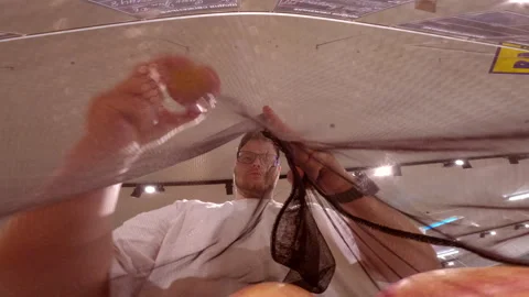View from inside of mesh bag man choosing apples Video stock 246416150