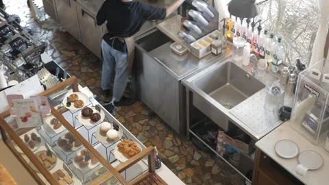 View inside the minimal caf while staffs doing their work prepared patry ba.. Stock Footage 246468333