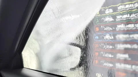 View From Inside Modern Car Cabin As Man Washes Vehicle At Station Stock Footage 336638026