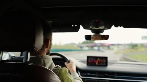 View from inside a modern car focused on the dashboard and navigation screen Stock Photos