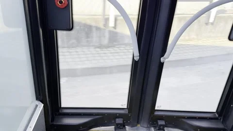 View from Inside Modern Public Transport Arriving at City Stop and Opening D Stock Footage 331164770