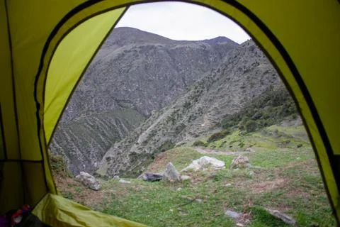 View from inside an open tent in a high mountain area Stock Photos
