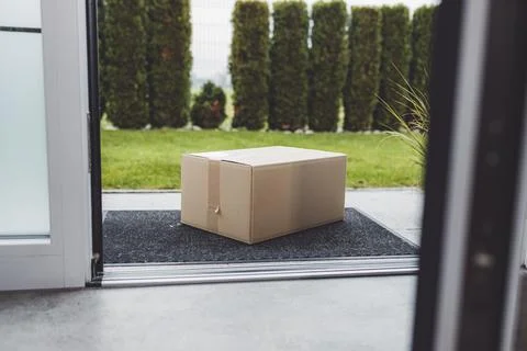 View from inside out, package sitting at the front door waiting to be picked up Stock Photos