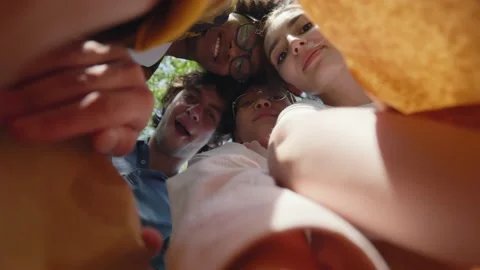 View from inside paper bag of international students take sandwich and bite at Stock Footage 158387902