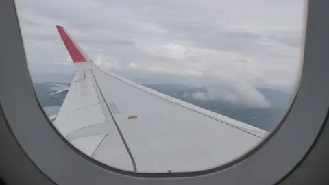 View from inside the plane cabin through out the window with view of winglet  Stock Footage 208939547
