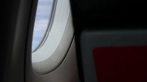 View inside plane cabin to the window with sunlight shine through plane's w.. Stock Footage 254154075