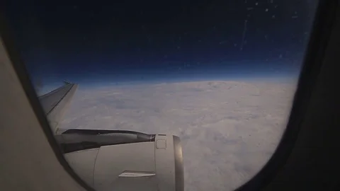 View from inside the plane is flying above the clouds Stock-Footage 73983583
