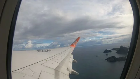 View from inside a plane leaving Fernando de Noronha archipelago, Brazil Video stock 172408948
