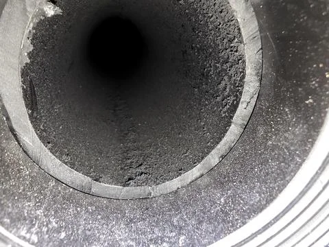 View of the Inside of a Plastic Pipe Showing Black Residue and Smooth Walls Stock Photos