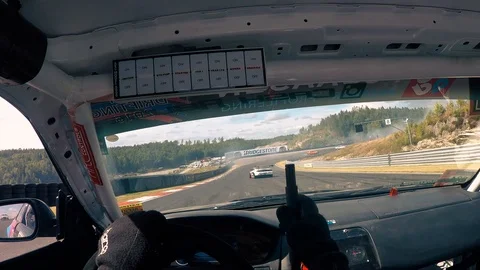 View from inside a racing car of a very dangerous curve on a race. Stock Footage 105826950