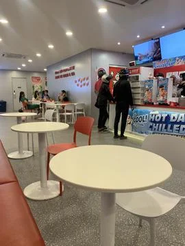 A view inside a restaurant, several customers are seen waiting for orders Stock Photos