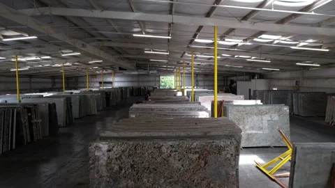 View Inside A Slab Warehouse And Showroom With Stacks Of Granite And Video stock 163786899