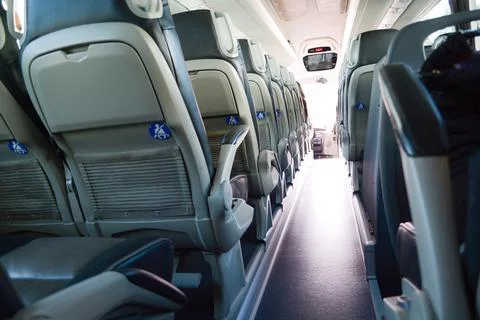 View from inside a stage coach Bus into the sunset - Bus interior trip with a Stock Photos