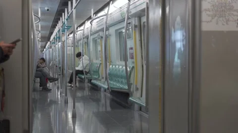View inside subway public transportation train commuter in Beijing metro wi.. Stock Footage 329668395