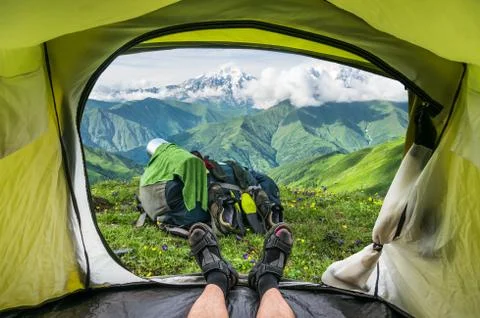 View from inside a tent on the snow-capped mountains in Georgia (Svaneti) Stock Photos