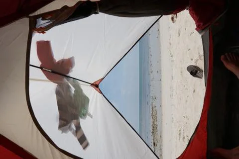 View from inside a tent on the waves and the sea in Malaysia Stock Photos