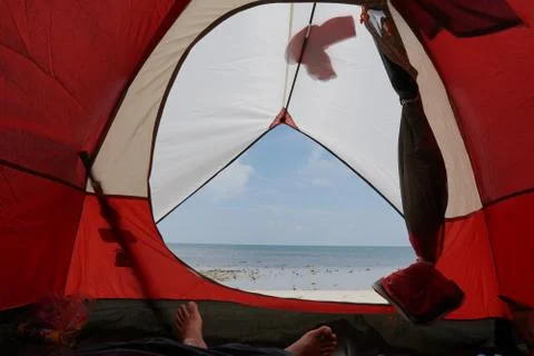 View from inside a tent on the waves and the sea in Malaysia Stock Photos