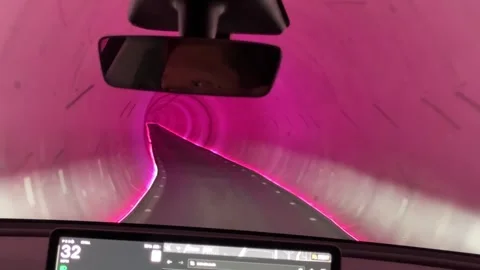 View from inside a vehicle driving through a Vegas Loop tunnel to the airport Stock Footage 338356645