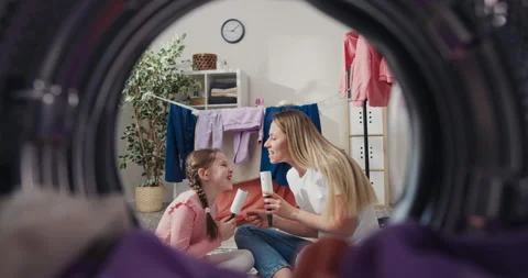 View from inside the washing machine drum into the laundry room. Mother and Stock Footage 199880392