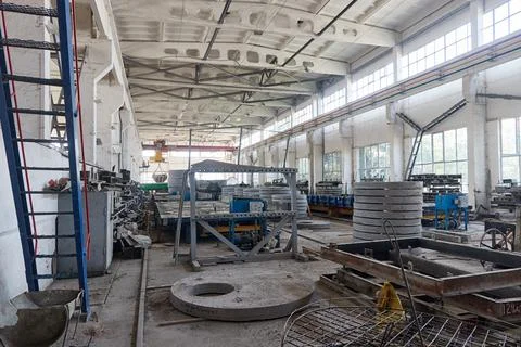 View from inside the workshop for the production of reinforced concrete produ Stock Photos