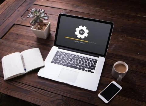 View of Installing update process with gearbox percentage progress and loading  Stock Photos