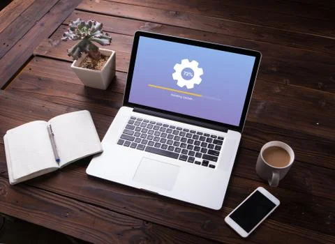 View of Installing update process with gearbox percentage progress and loading  Stock Photos