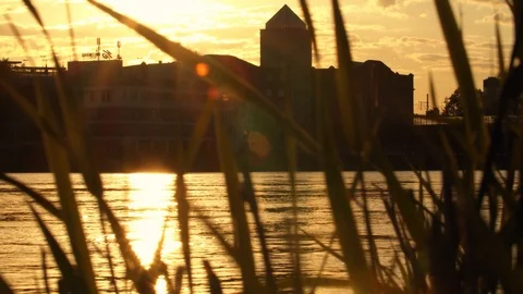 View of Interesting Building on the other Side of the River at Sunset Video stock 120554142