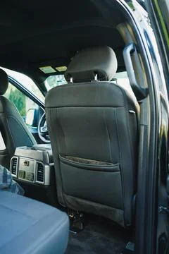View of the interior back seat of a modern car during daylight, showcasing .. 写真素材
