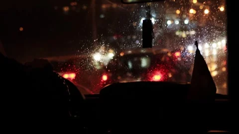 View from the interior of the car windshield at night. Rainy weather, poor Stock Footage 243161603