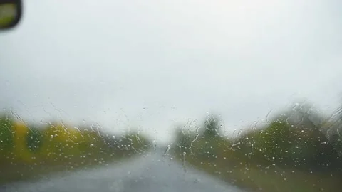 View from the interior of the car on  windshield in rainy autumn weather.Wipers Stock Footage 218198683