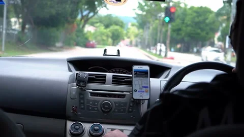 A view from the interior of a left-hand drive car where driver is checking map Stock Footage 237167818