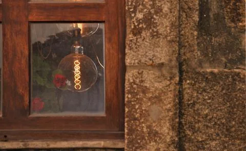 View to the interior of an old house through a glass window Stock Photos