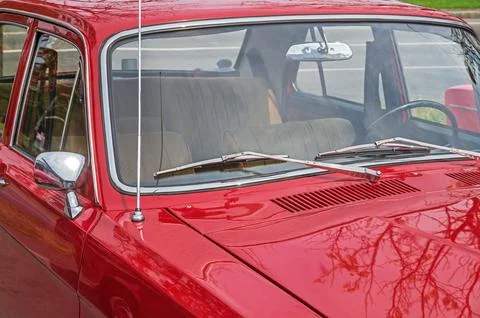 View on interior of retro car through windshield from the side of hood Stock Photos