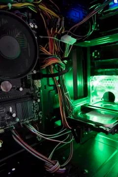 View of the internal structure of the pc with a green light from the inside Stock Photos